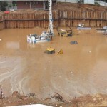 Work site inundation, danger of collapse to surrounding buildings